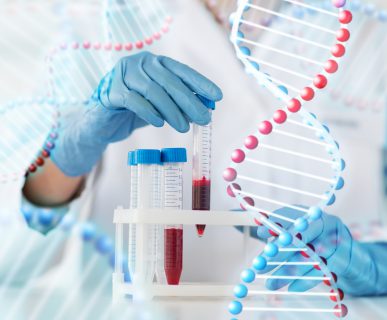 close up of scientist with tube making test in lab